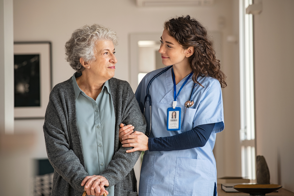 A nurse offers respite care to an older loved one in need.
